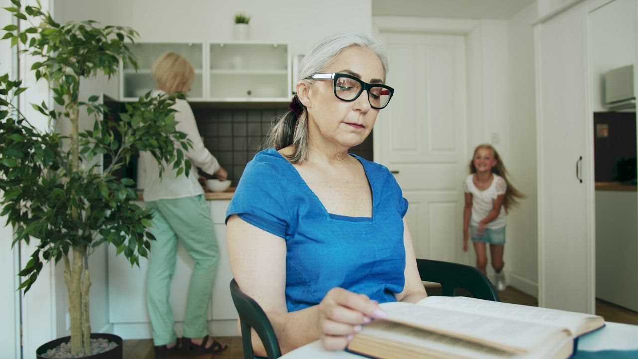A grandmother visiting with her granddaughter